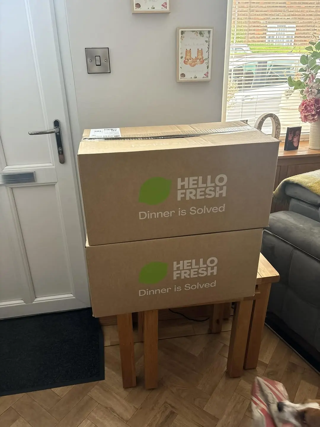 Two HelloFresh boxes stacked by the front door