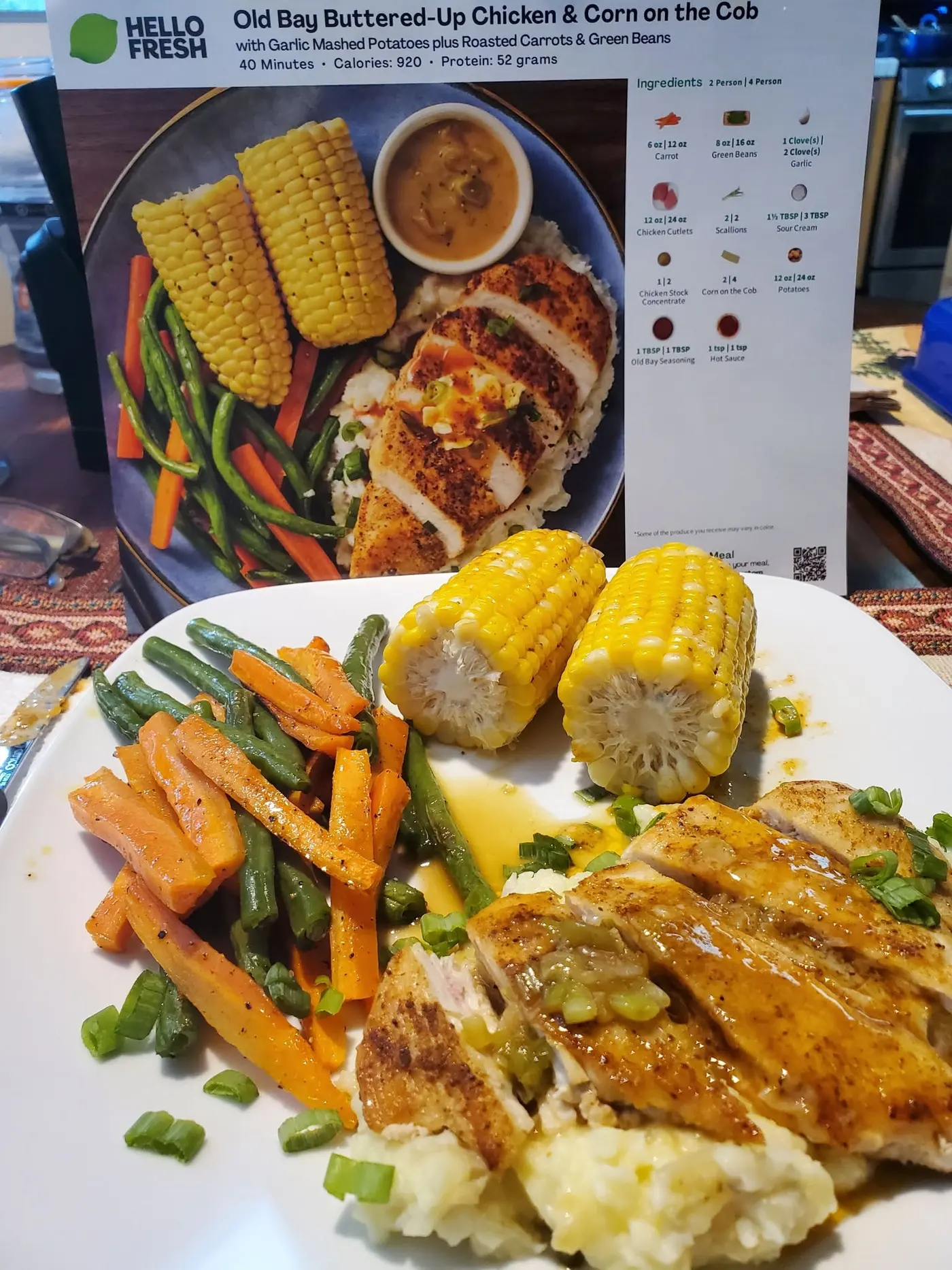 Cooked HelloFresh chicken dinner plated in front of its recipe card
