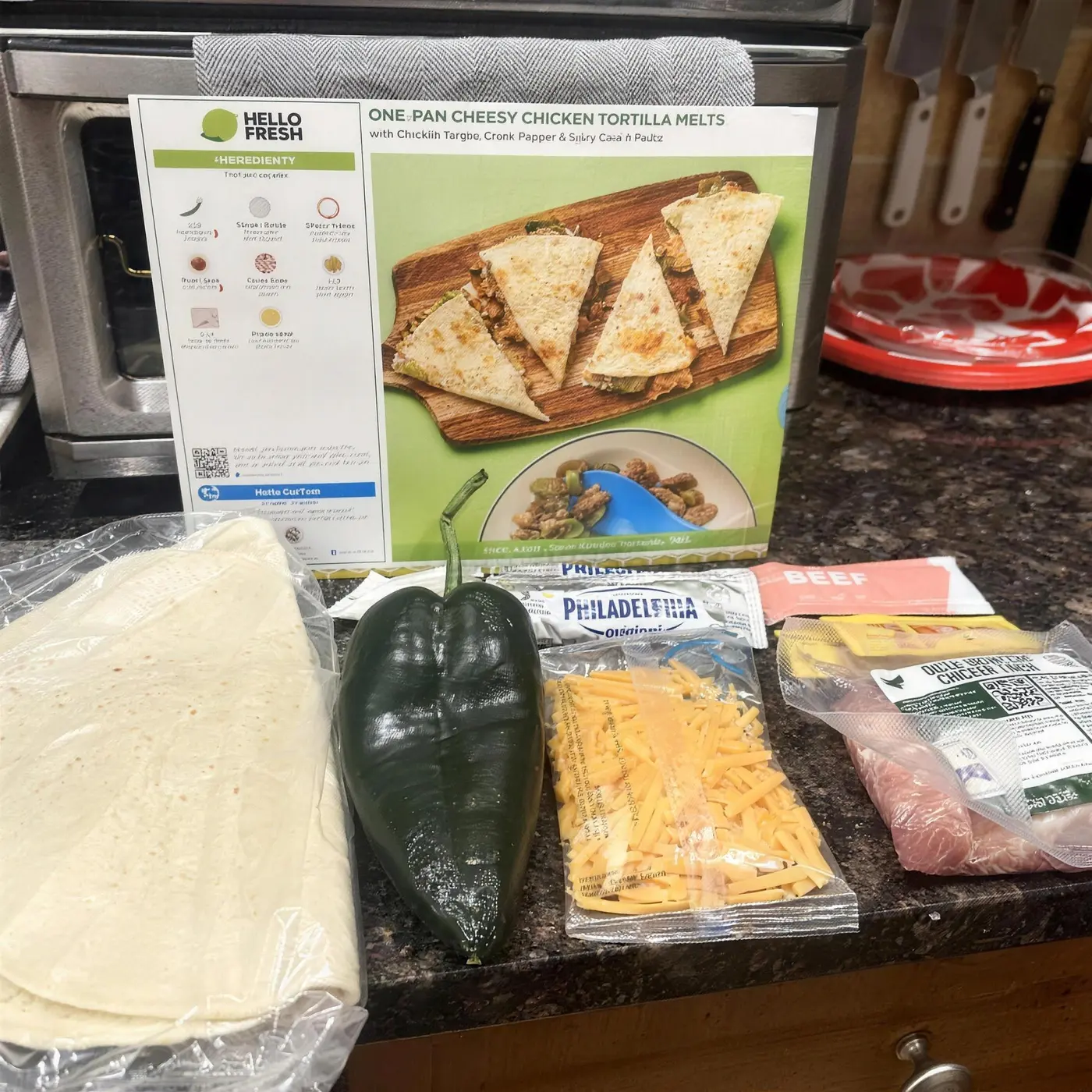 HelloFresh recipe card with fresh ingredients laid out on a counter